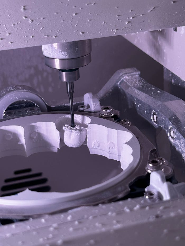 Mastering the First Impression: Your intriguing post title goes here Close-up of a CNC milling machine creating detailed components.